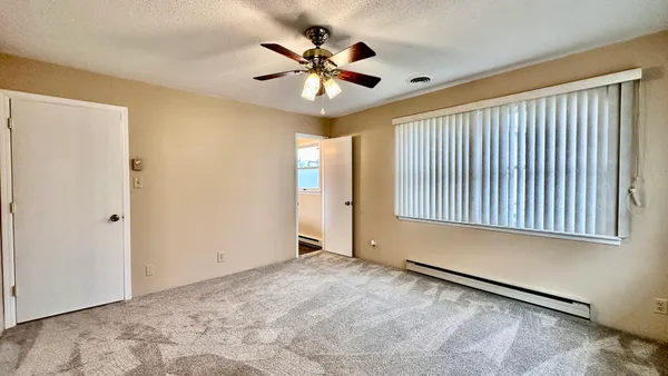 a view of an empty room with a window
