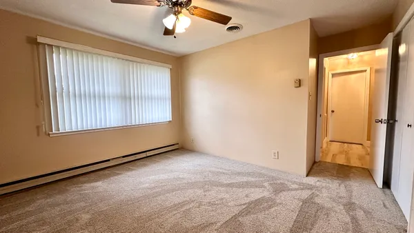 a view of an empty room with a window