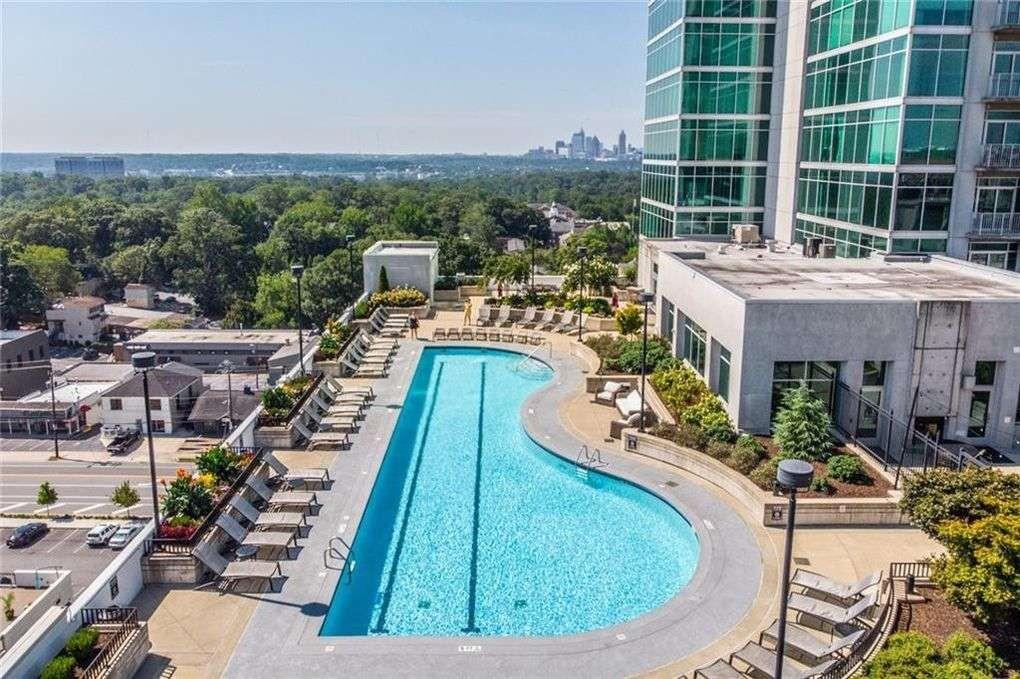 250 Pharr Road Northeast, Unit 2002 Atlanta, GA 30305 - Photo 10 of 13 a view of a swimming pool with a patio