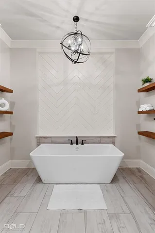 a bath tub sitting in a bathroom next to a window