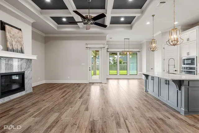 a view of kitchen with cabinets and wooden floor