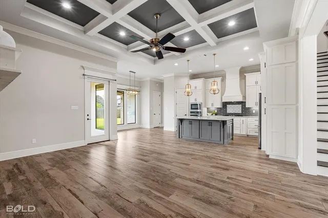 wooden floor in an empty room with a fireplace