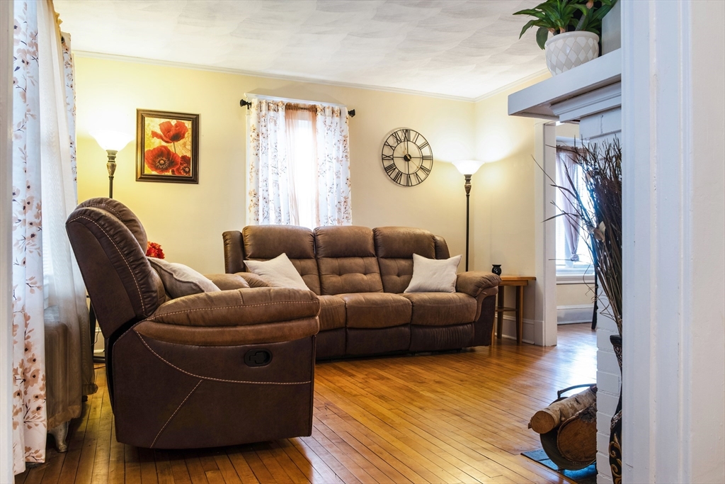 39 Meredith Street Springfield, MA 01108 - Photo 2 of 36 a living room with furniture and a couch