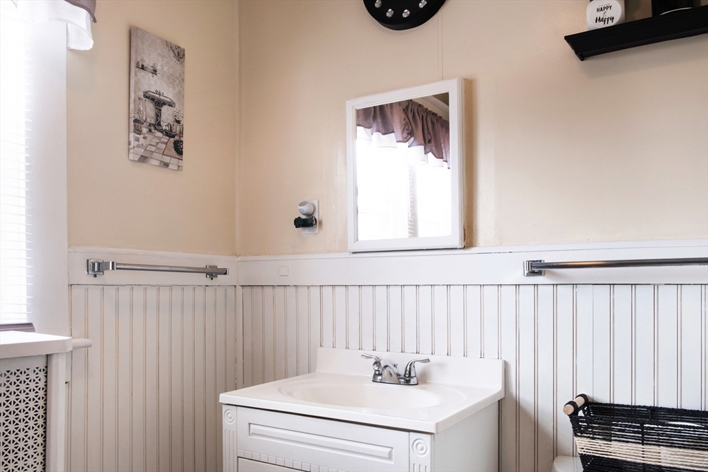 39 Meredith Street Springfield, MA 01108 - Photo 21 of 36 a bathroom with a sink and a mirror