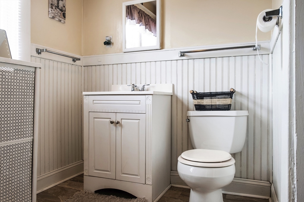 39 Meredith Street Springfield, MA 01108 - Photo 22 of 36 a bathroom with a toilet a sink and a window