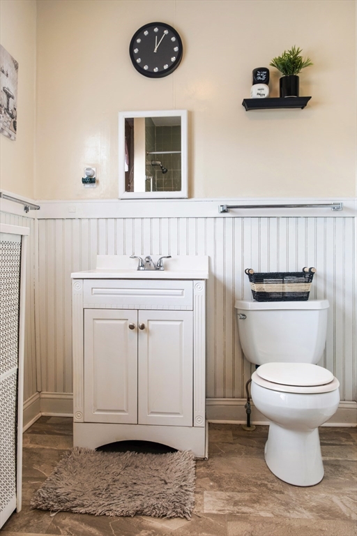 39 Meredith Street Springfield, MA 01108 - Photo 23 of 36 a bathroom with a toilet a sink and a window
