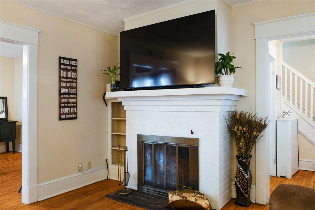 39 Meredith Street Springfield, MA 01108 - Photo 3 of 36 a living room with furniture and a fireplace