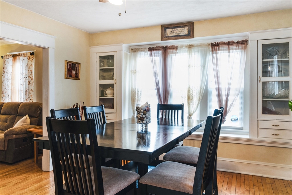 39 Meredith Street Springfield, MA 01108 - Photo 4 of 36 a view of a dining room with furniture window and wooden floor