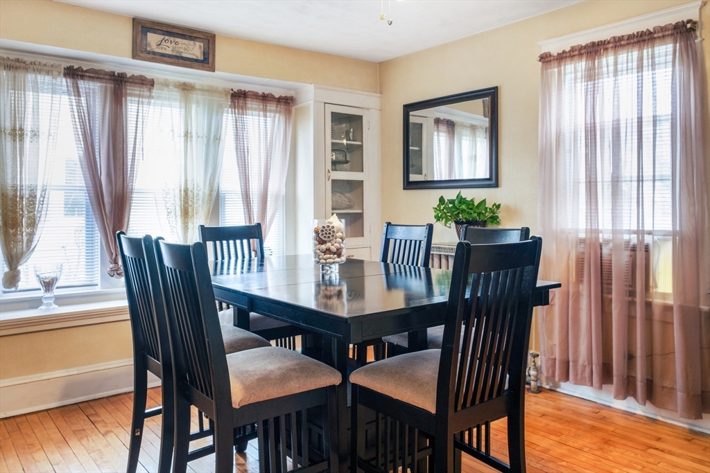 39 Meredith Street Springfield, MA 01108 - Photo 5 of 36 a view of a dining room with furniture window and wooden floor