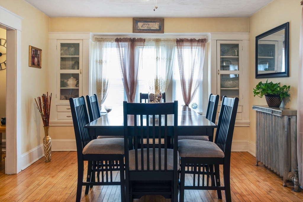 39 Meredith Street Springfield, MA 01108 - Photo 6 of 36 a view of a dining room with furniture window and wooden floor