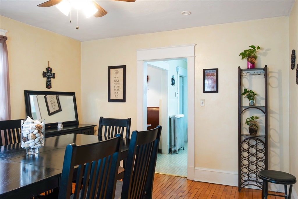 39 Meredith Street Springfield, MA 01108 - Photo 7 of 36 a view of a dining room with furniture and wooden floor