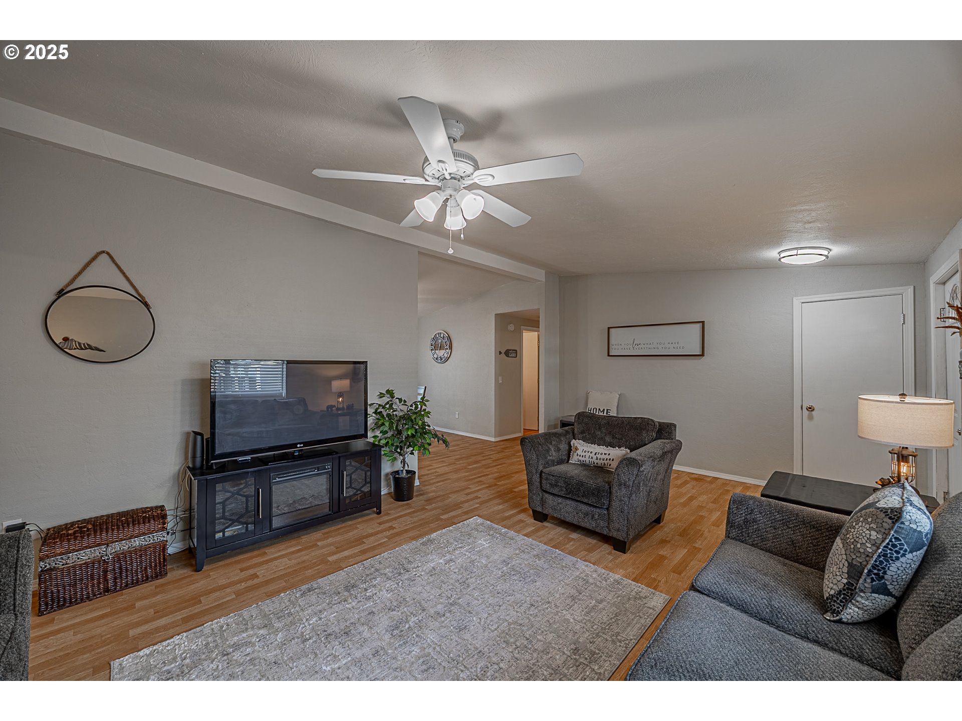 150 North 11th Street Lakeside, OR 97449 - Photo 12 of 37 a living room with furniture and a flat screen tv