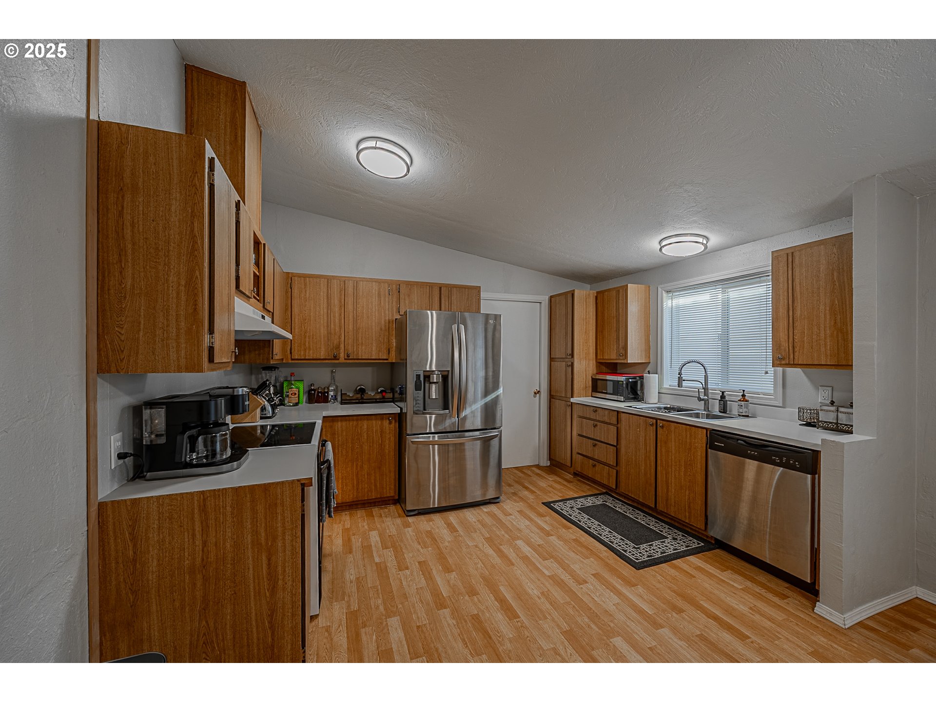 150 North 11th Street Lakeside, OR 97449 - Photo 17 of 37 a kitchen with a refrigerator stove top oven and sink