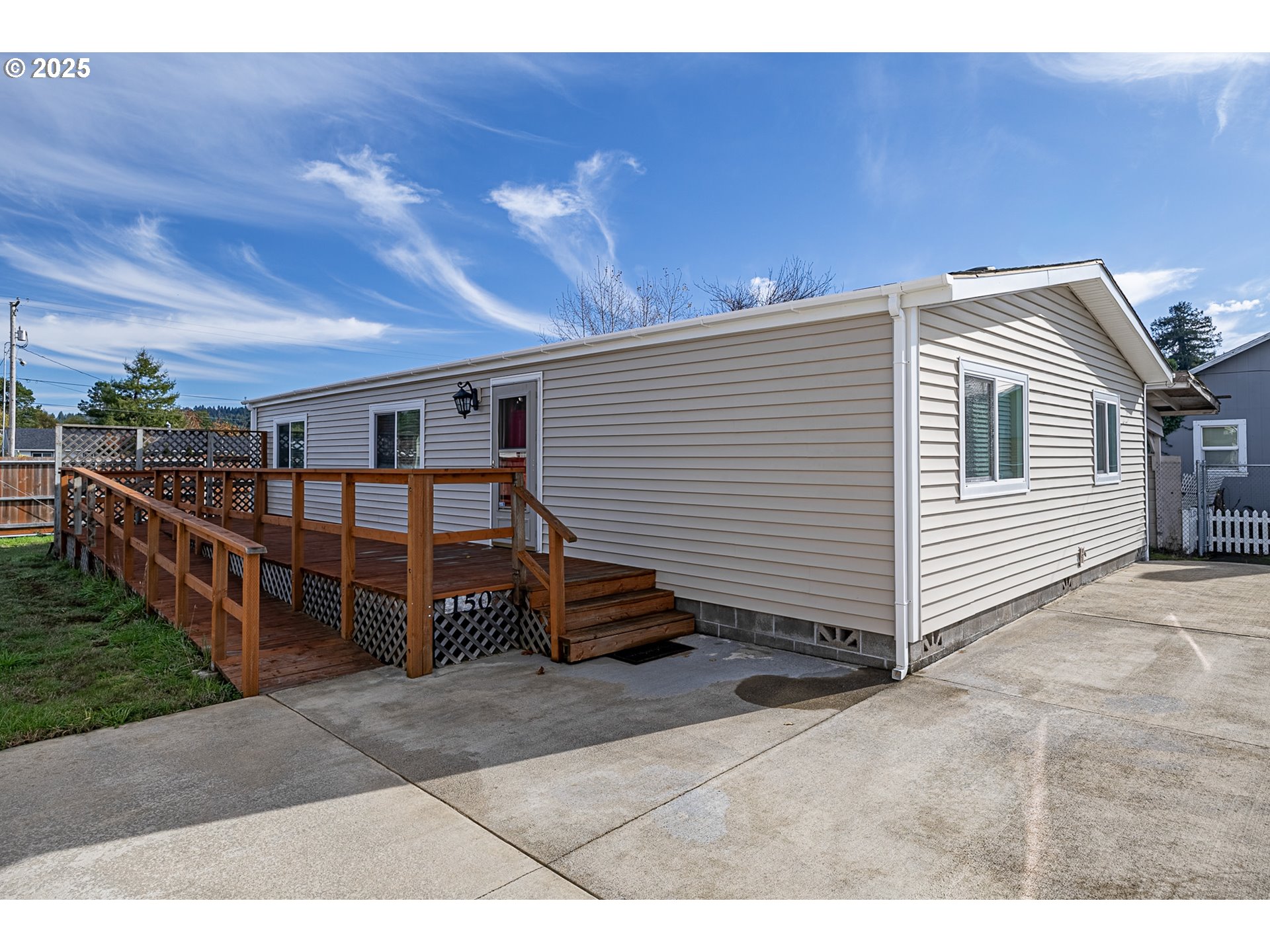 150 North 11th Street Lakeside, OR 97449 - Photo 2 of 37 a view of a house with a balcony