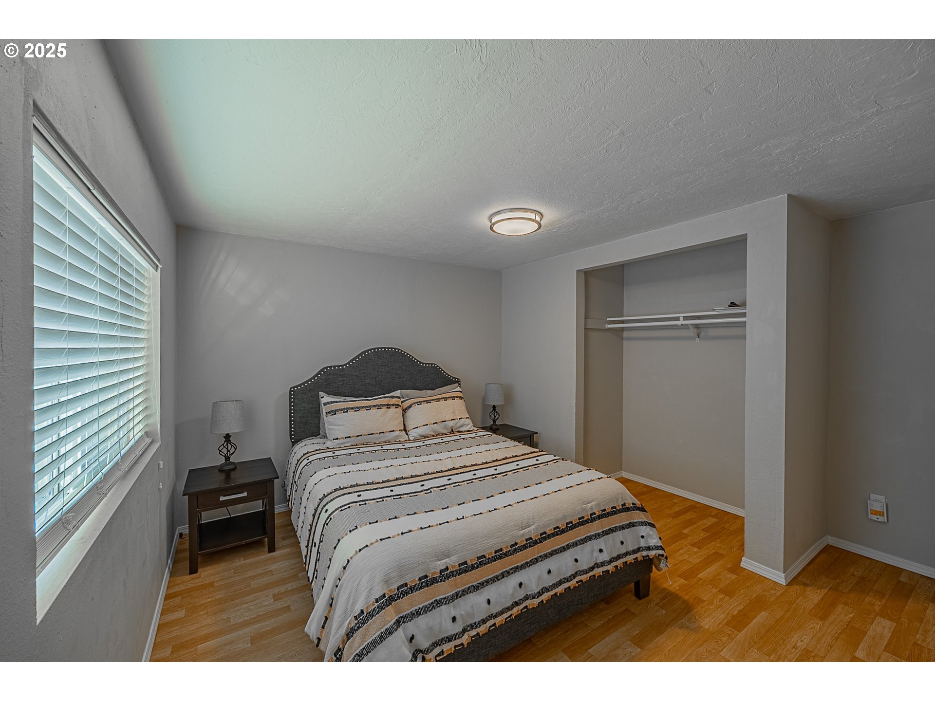 150 North 11th Street Lakeside, OR 97449 - Photo 21 of 37 a bedroom with a bed and a cabinets