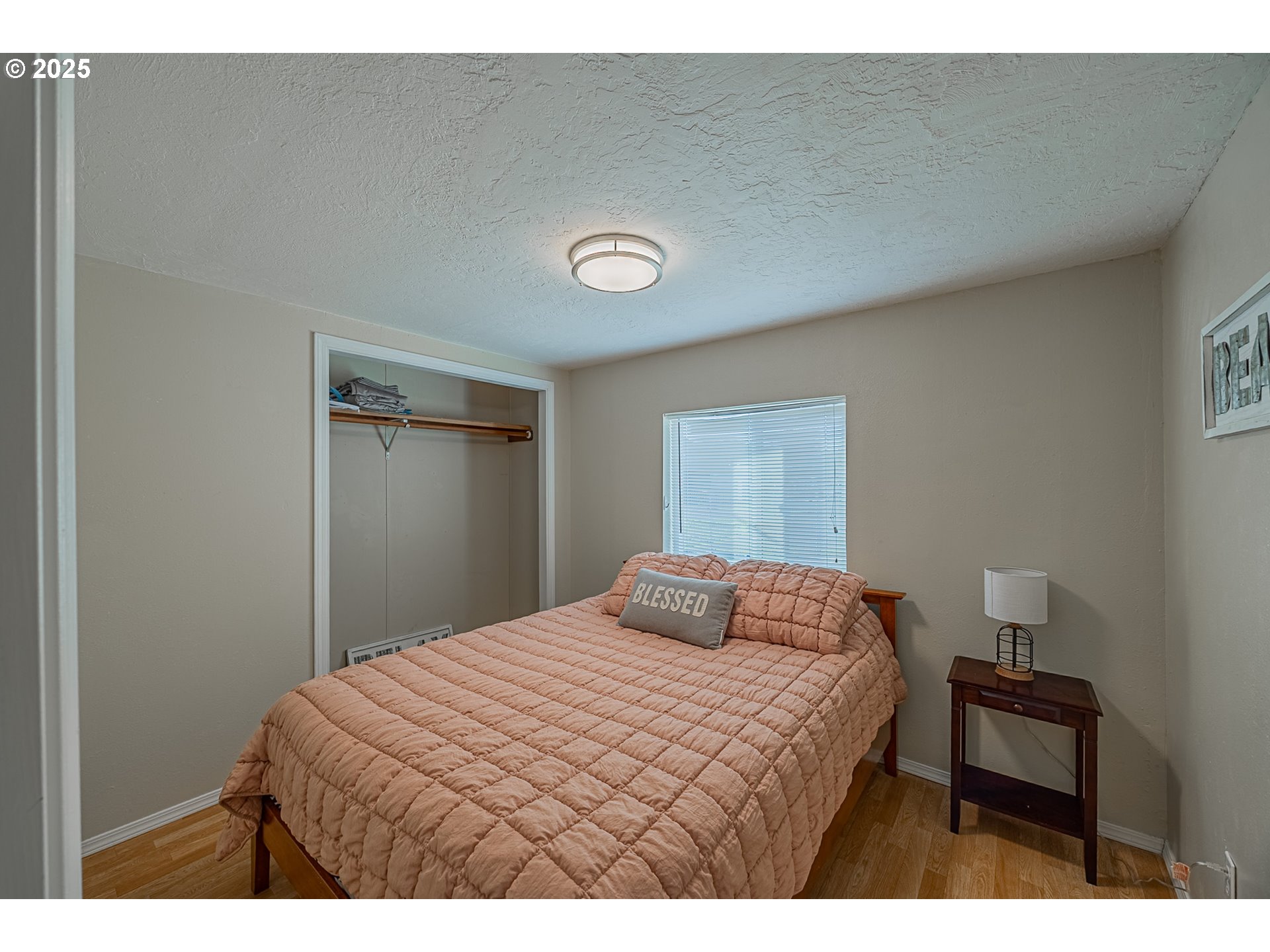 150 North 11th Street Lakeside, OR 97449 - Photo 22 of 37 a bedroom with a bed and a table