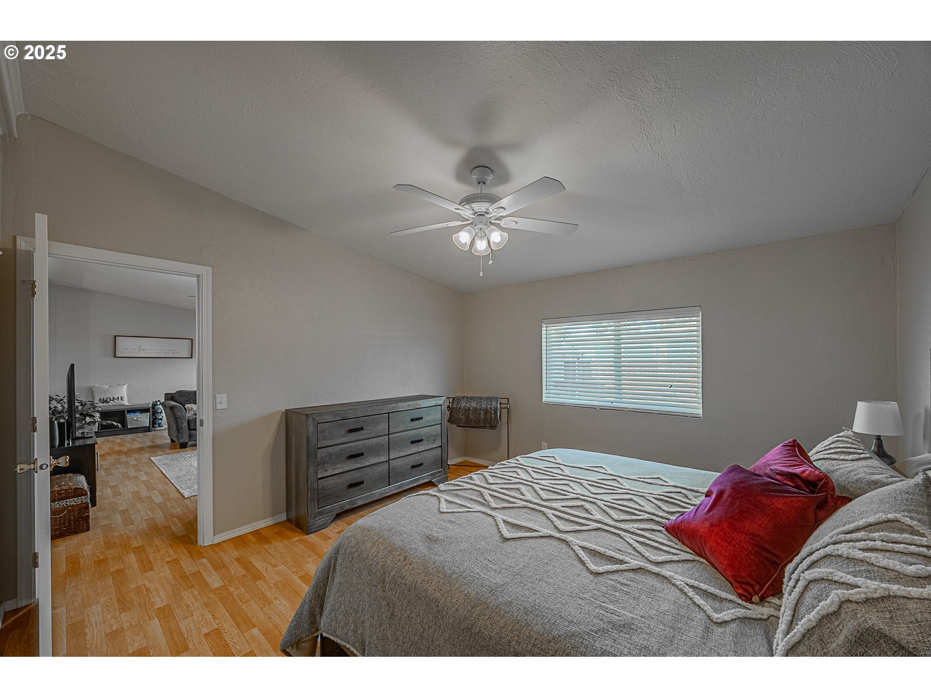 150 North 11th Street Lakeside, OR 97449 - Photo 28 of 37 a bedroom with a bed and ceiling fan