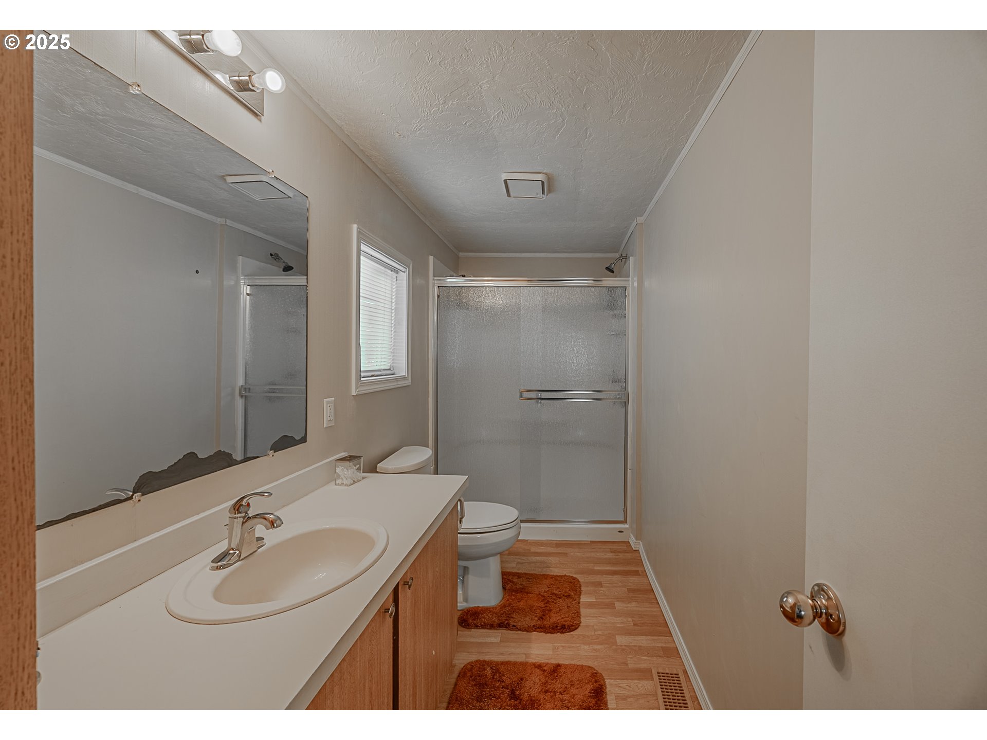 150 North 11th Street Lakeside, OR 97449 - Photo 30 of 37 a bathroom with a sink and a mirror