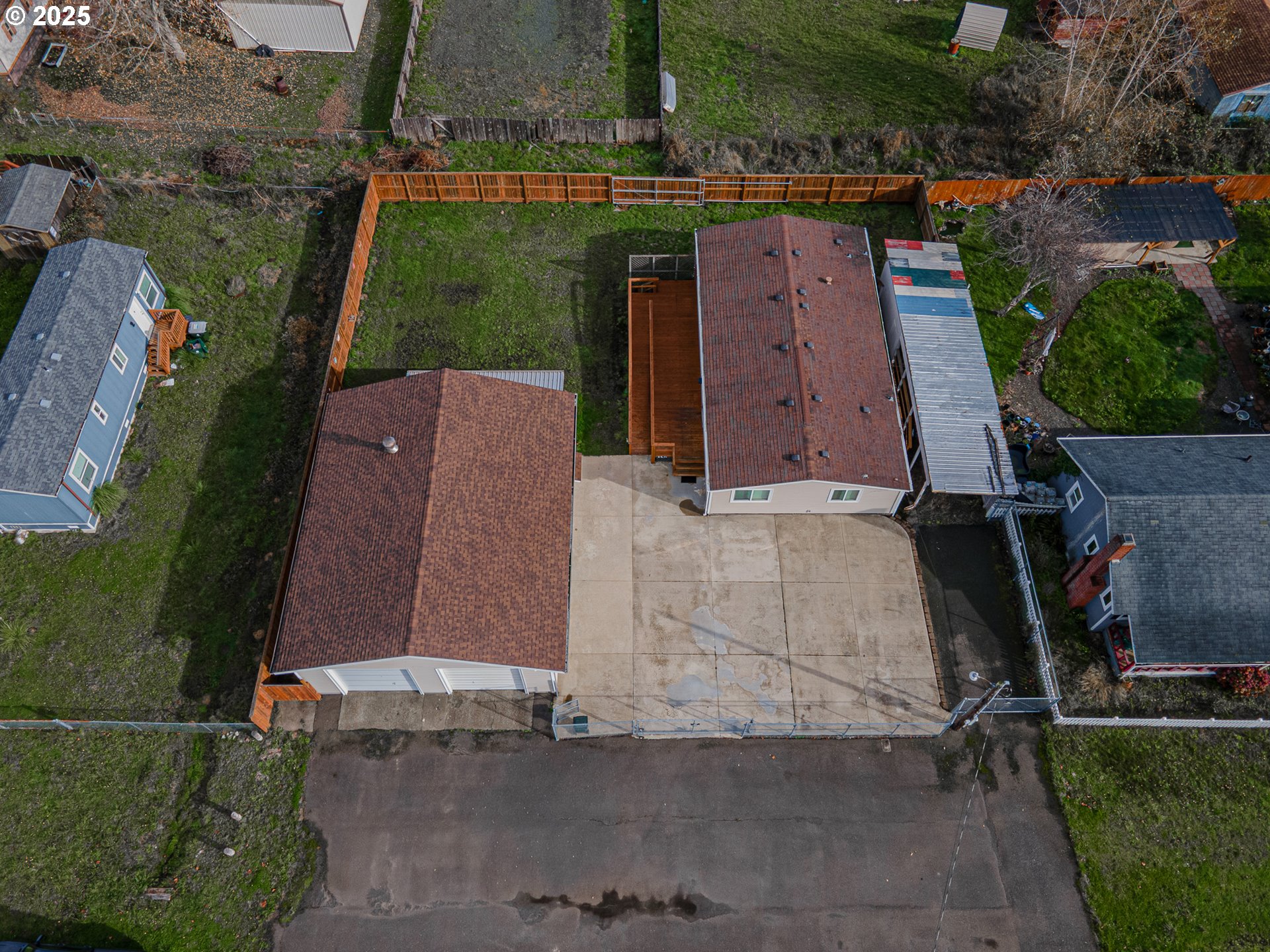 150 North 11th Street Lakeside, OR 97449 - Photo 34 of 37 an aerial view of a house with a yard