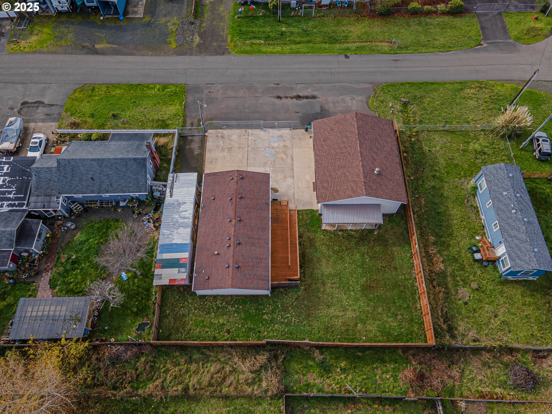 150 North 11th Street Lakeside, OR 97449 - Photo 35 of 37 an aerial view of a house with a yard