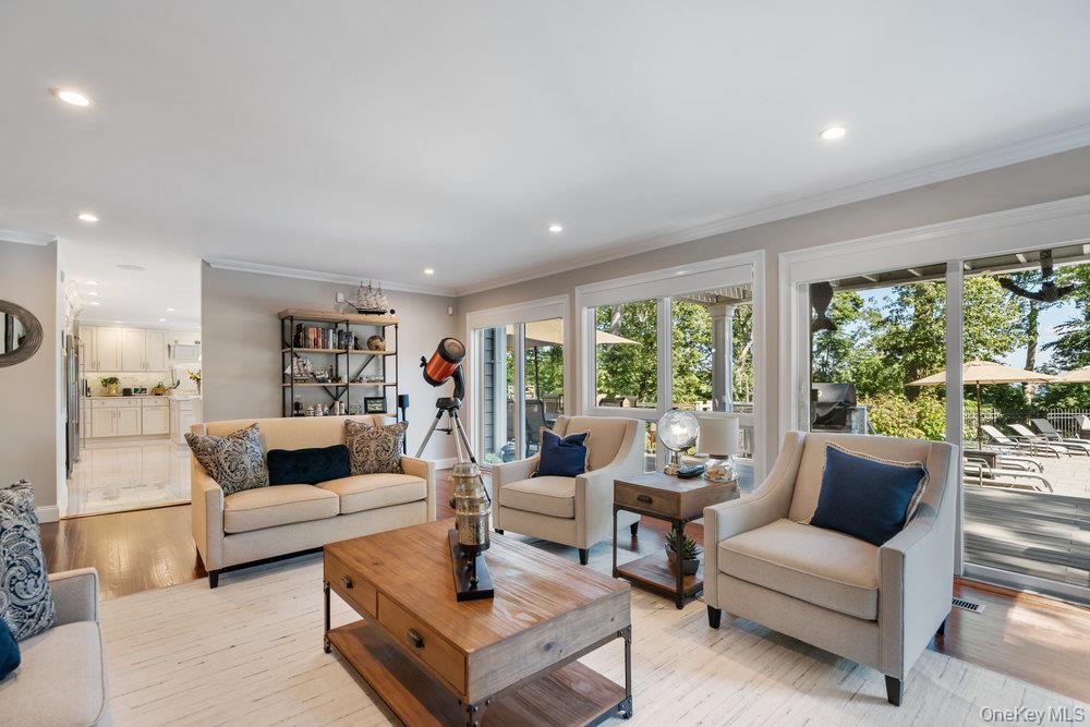 5 Coon Hollow Road Lloyd Harbor, NY 11743 - Photo 14 of 43 a living room with furniture and a large window