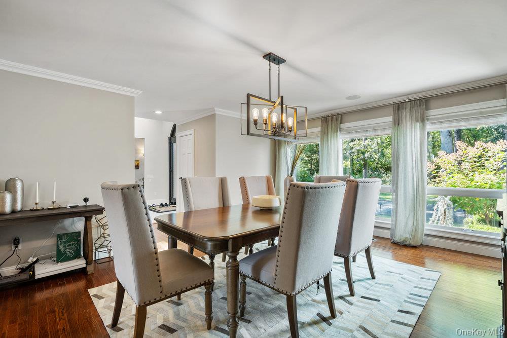 5 Coon Hollow Road Lloyd Harbor, NY 11743 - Photo 16 of 43 a view of a dining room with furniture window and wooden floor