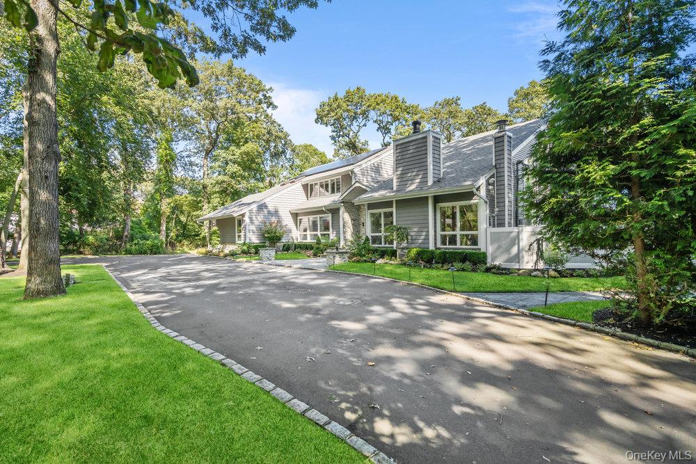 5 Coon Hollow Road Lloyd Harbor, NY 11743 - Photo 2 of 43 a view of a house with a yard
