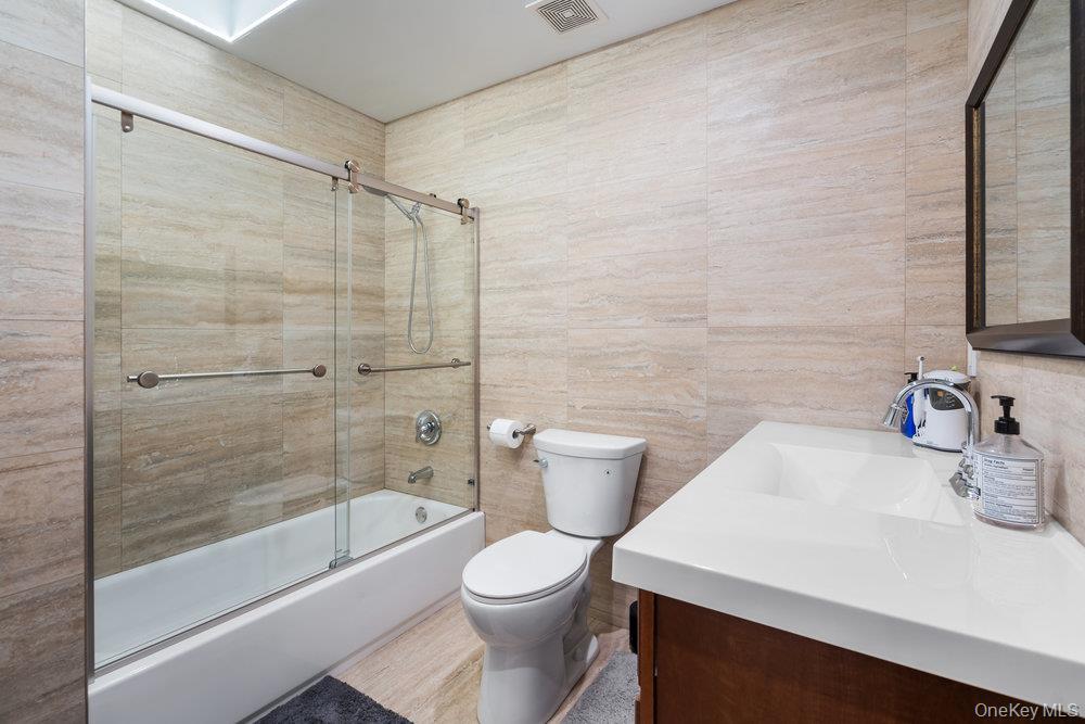 5 Coon Hollow Road Lloyd Harbor, NY 11743 - Photo 23 of 43 a bathroom with a sink toilet and shower