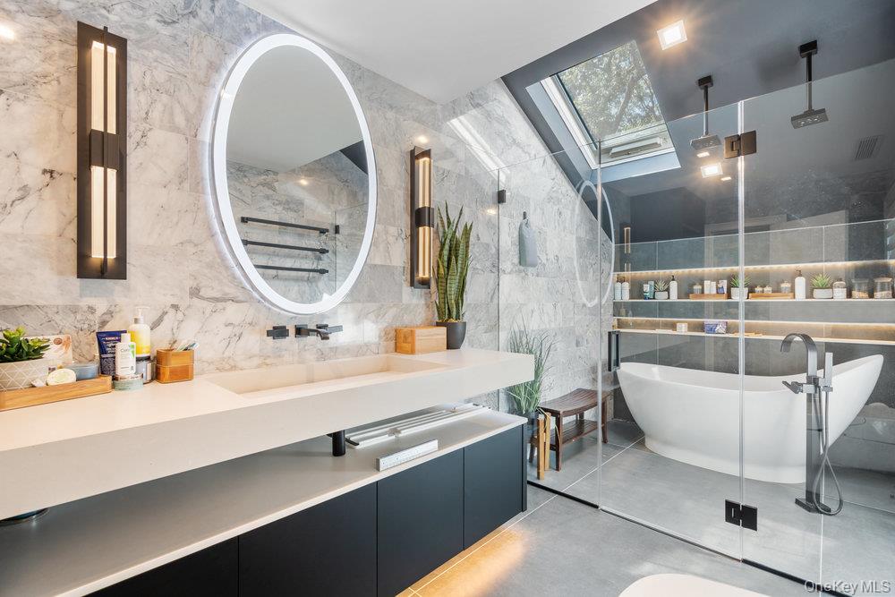 5 Coon Hollow Road Lloyd Harbor, NY 11743 - Photo 25 of 43 a bathroom with a double vanity sink a two mirror and a