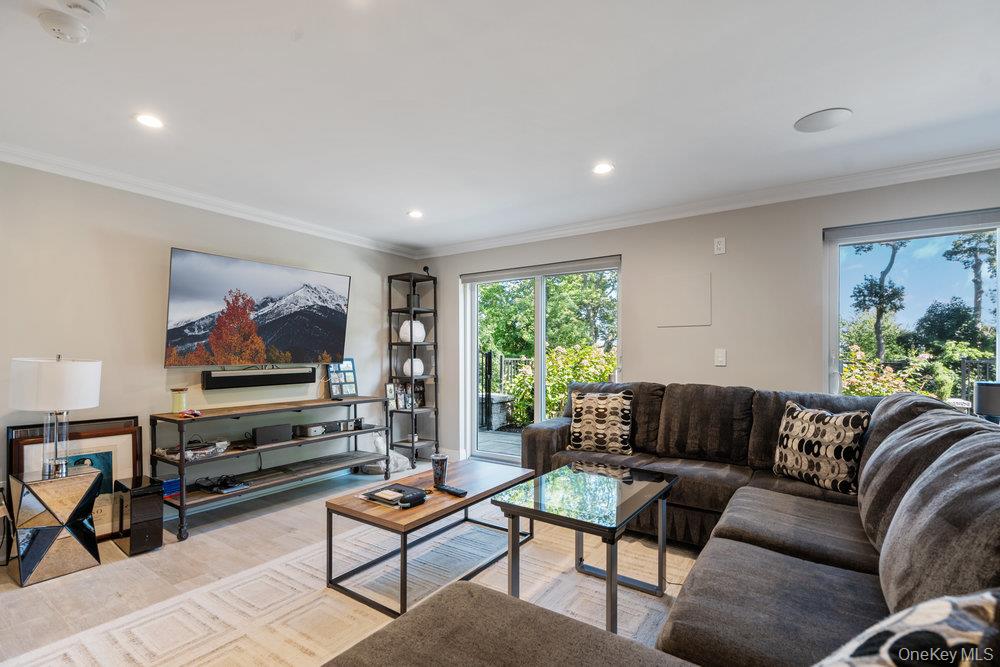 5 Coon Hollow Road Lloyd Harbor, NY 11743 - Photo 29 of 43 a living room with furniture and a flat screen tv