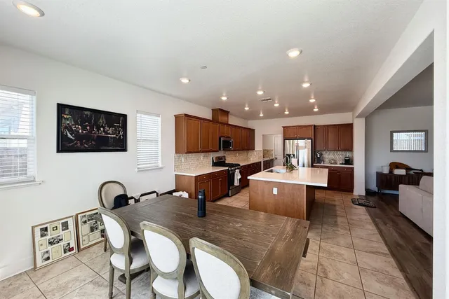a large room with table tennis and a table
