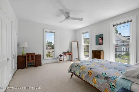 a bedroom with a bed and a couch