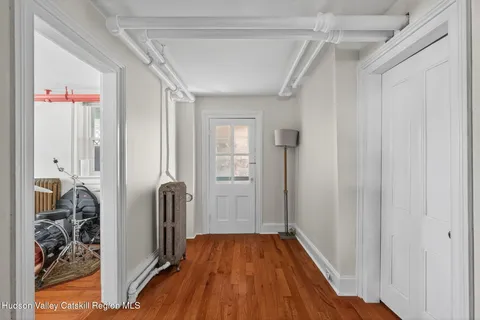 a workspace with furniture window and wooden floor