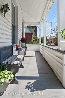 a lobby with furniture and flowers