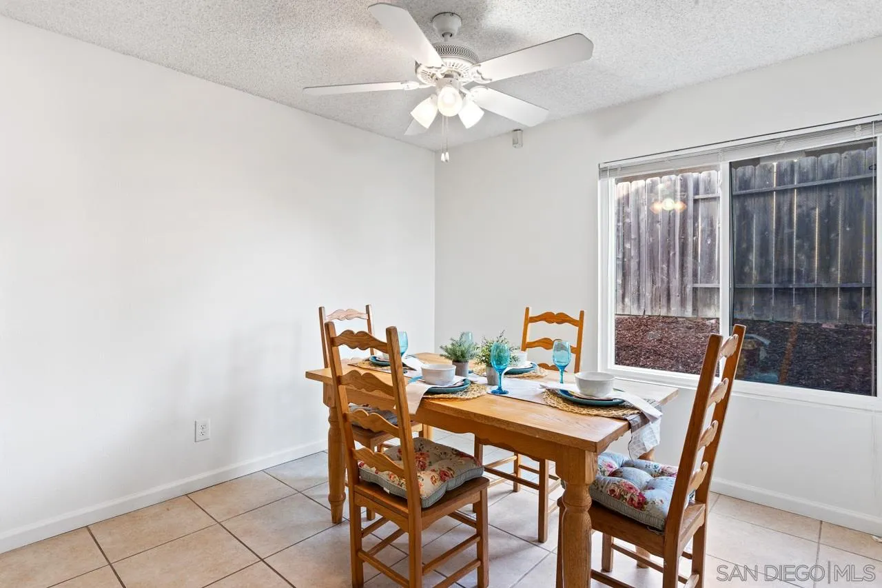 395 Compass Road Oceanside, CA 92054 - Photo 5 of 25 a view of a dining room with furniture and chandelier