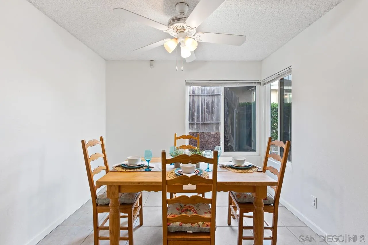 395 Compass Road Oceanside, CA 92054 - Photo 6 of 25 a view of a dining room with furniture and chandelier