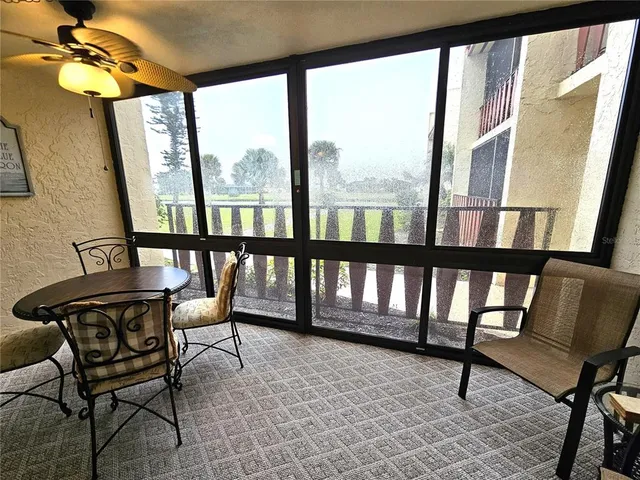 a view of a porch with chairs and furniture