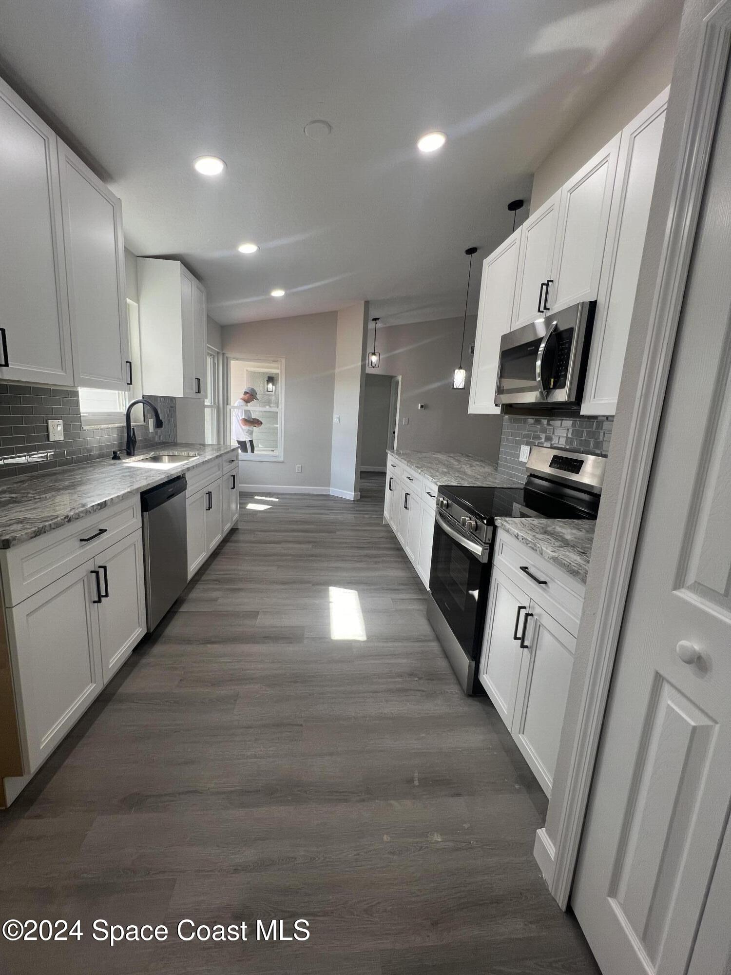 379 Sauders Road Southeast Palm Bay, FL 32909 - Photo 8 of 64 20241115_175144354_iOS