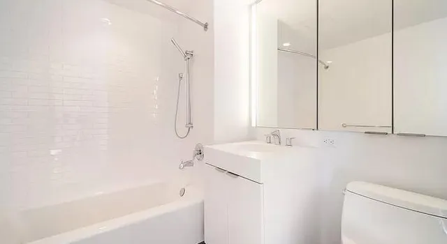 a bathroom with a bathtub and a sink