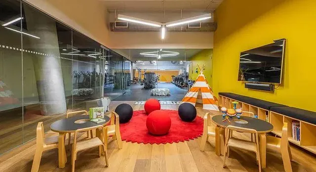 a room with lots of furniture and a rug