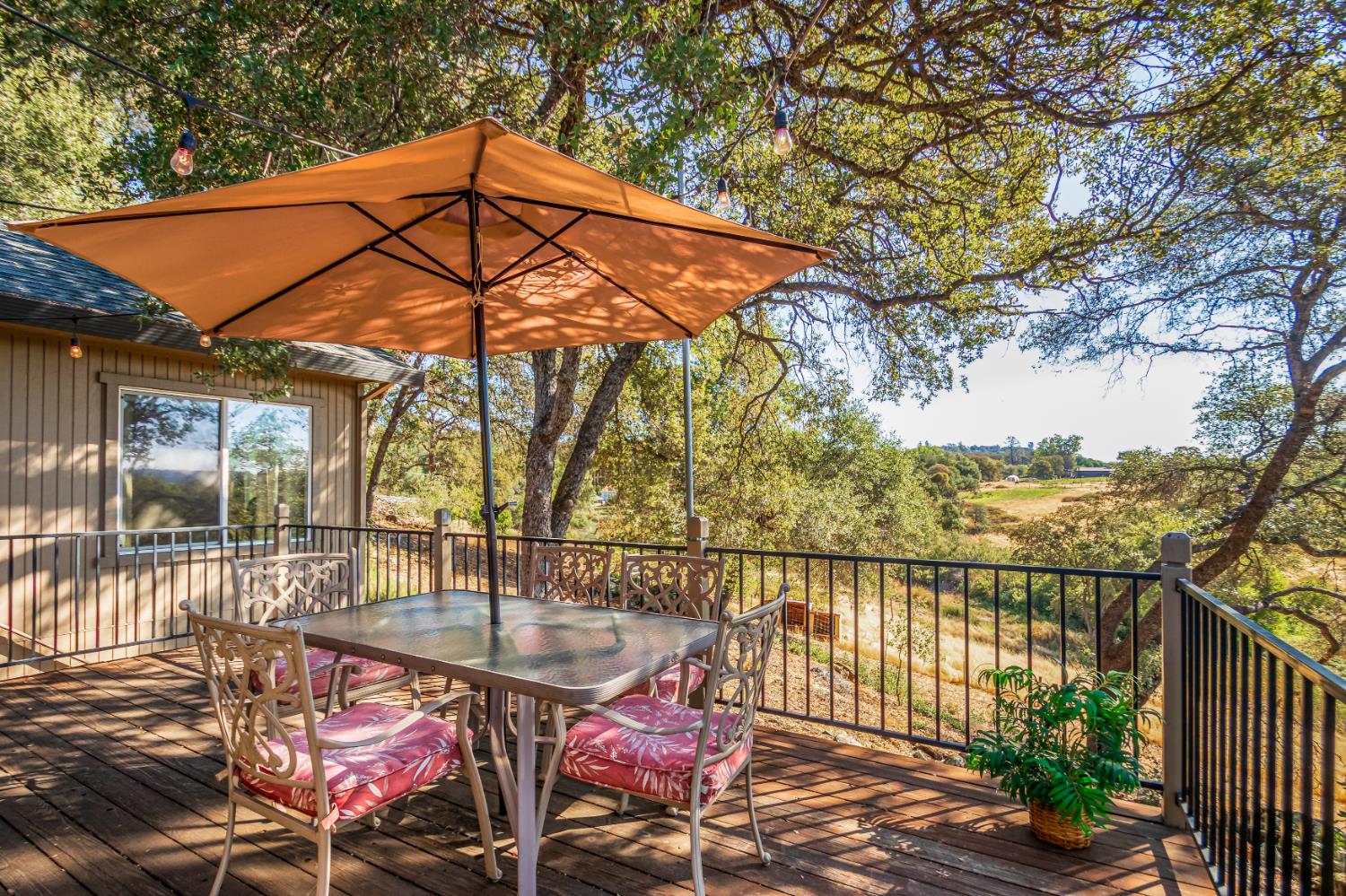 9290 Cramer Road Auburn, CA 95602 - Photo 38 of 67 a patio with water view fountain with wooden fence and floor
