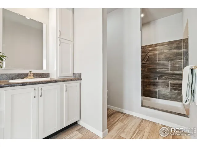 a view of vanity with mirror