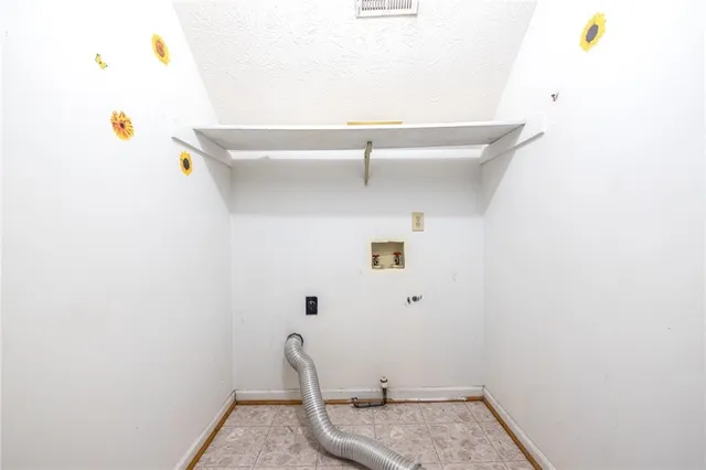 wooden floor chandelier and windows in a room