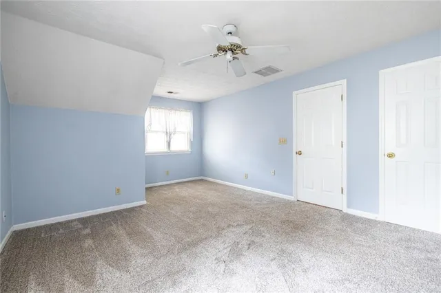 a room with furniture and wooden floor
