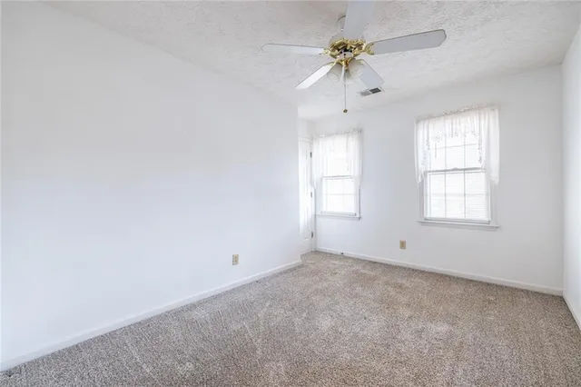 a view of empty room with windows
