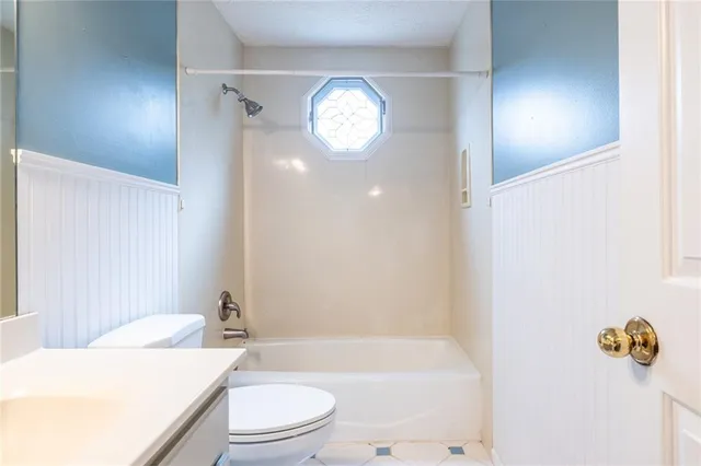 a view of a house with brick walls