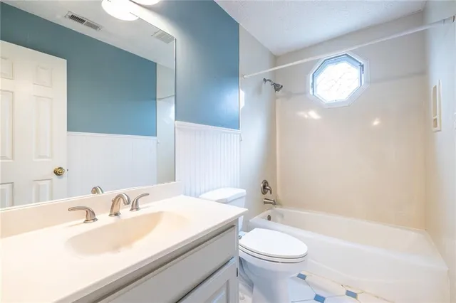 a view of a deck with wooden floor and fence