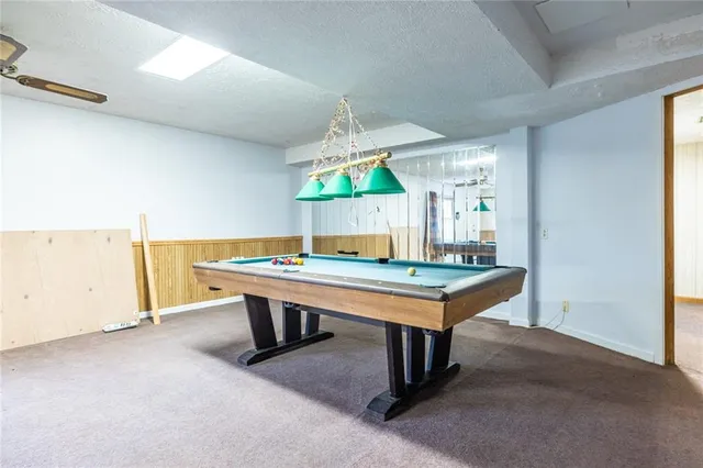 a view of backyard with large trees