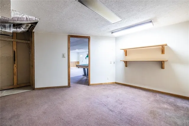 a picture of a wall with a white building