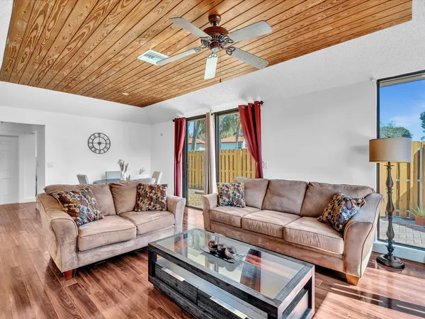 a living room with furniture a fireplace and a table